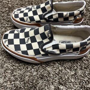 Vans Black and Cream Checkered Slip-On Sneakers